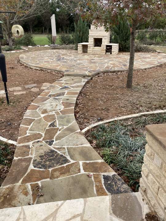 Flagstone path and steps curving through a gravel and native planting bed