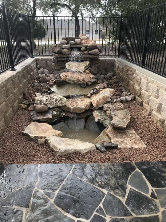 Stacked flagstone waterfall feature in a bed