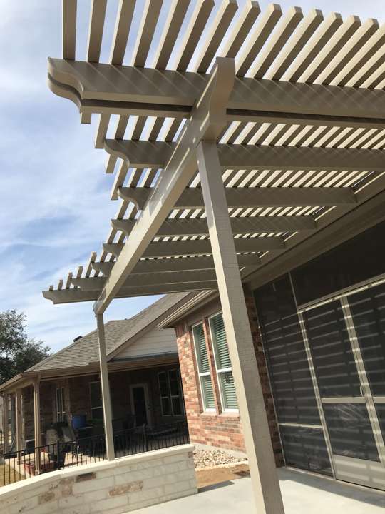 Pergola attached to a house over a patio