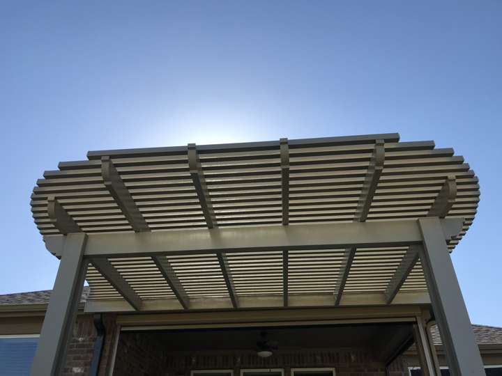 Slatted pergola against a clear sky