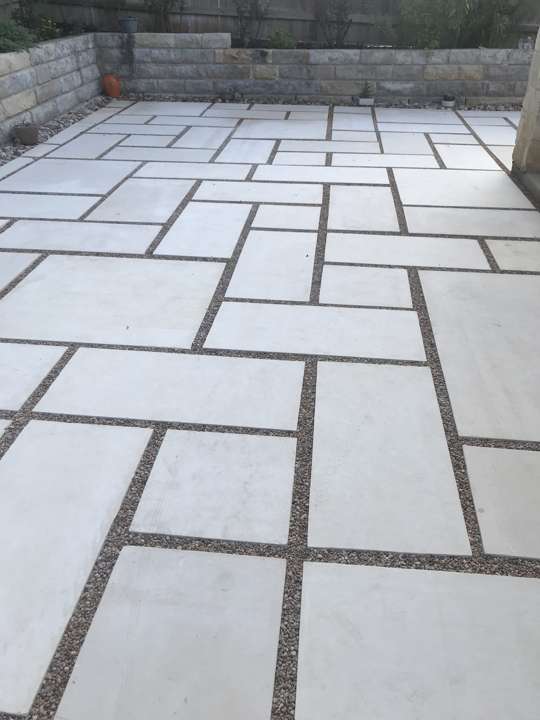 Large-format cut-stone patio with gravel joints