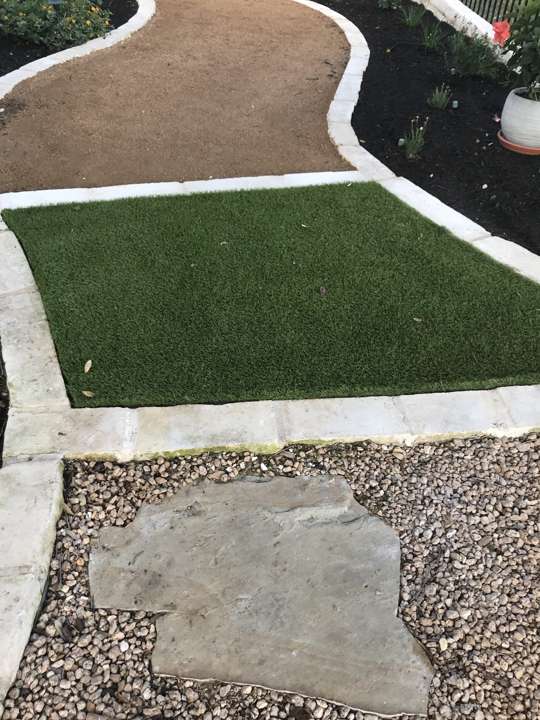 Fresh sod beside a decomposed granite path and a flagstone stepper